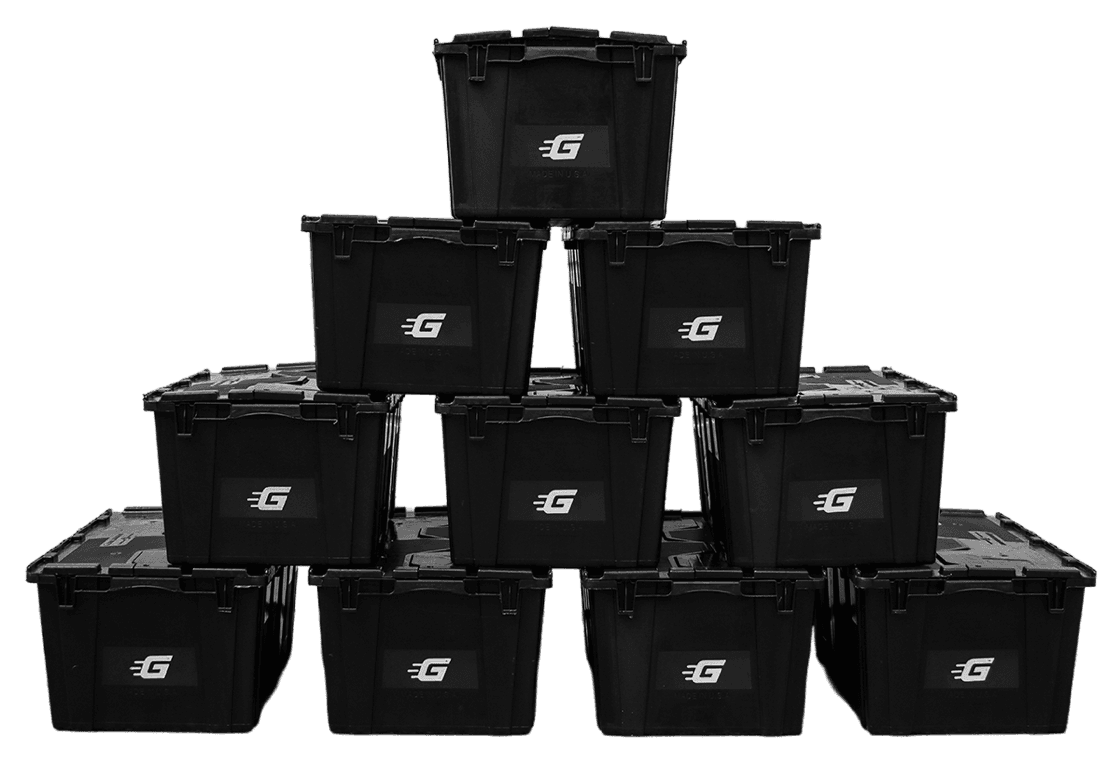 A pyramid of black Ghatt2Go bins stacked outside the warehouse
